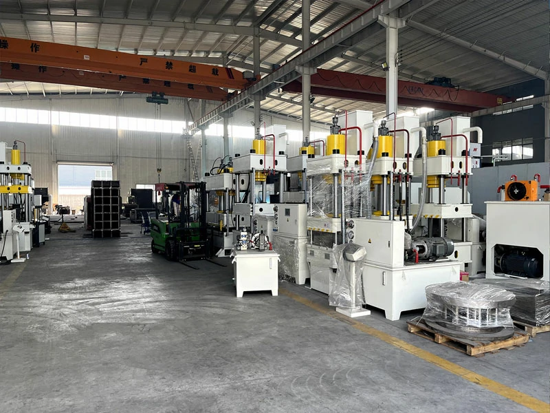 Corner of LS factory workshop showing hydraulic press machines