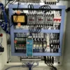 Electrical cabinet interior of 100 ton hydraulic punching press machine, stable power control system for industrial automation